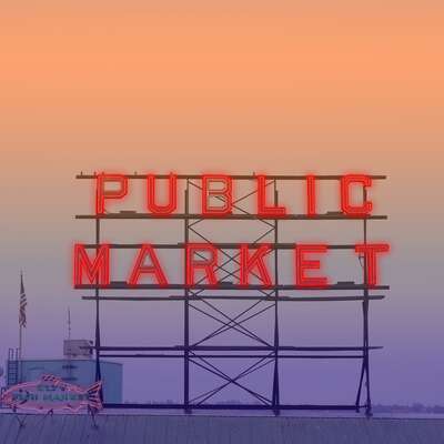 Public Market sign at sunset, symbolizing vibrant team-building events in dynamic, urban settings. Ideal for HR professionals seeking engaging activities.